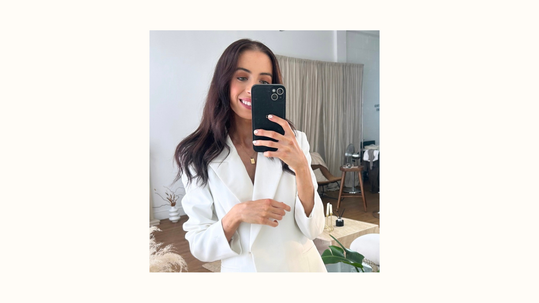 KUOTES founder behind the scenes wearing the Kora Blazer Dress — building a minimalist fashion brand empowering women through elegant, tailored design and purpose-driven storytelling.
